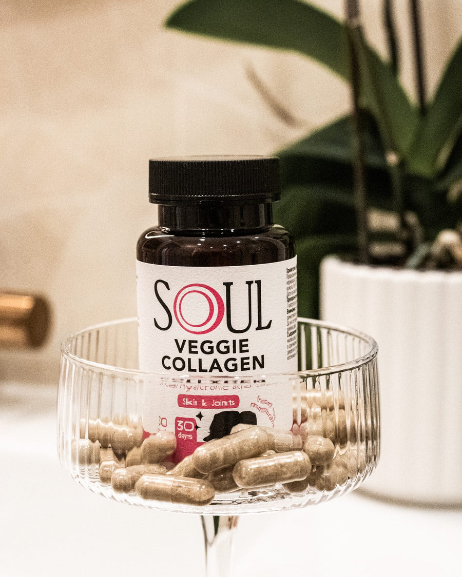 SOUL Veggie Collagen in a glass bowl of capsules in the bathroom