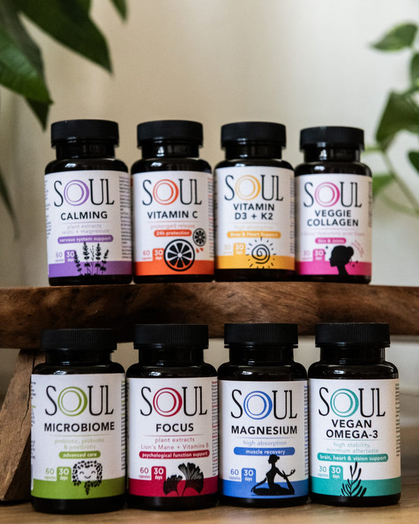 The eight SOUL products in two rows on a wooden stand